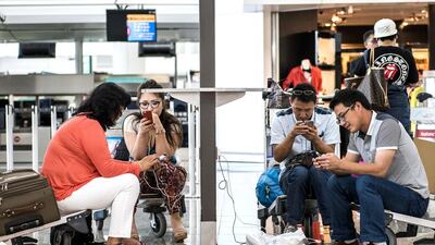Airports have created multiple charging points as travellers increasingly rely on their electronic devices. Xaume Olleros / Bloomberg