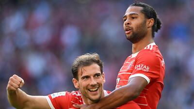 Serge Gnabry (r) celebrates with Leon Goretzka after opening the scoring in Bayern's 6-2 Bundesliga win against Mainz in Munich on October 29, 2022. AFP