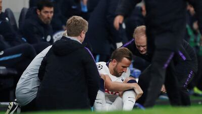 Tottenham's Harry Kane receives medical attention. Reuters