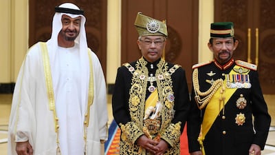 Malaysia's King Abdullah Riayatuddin Al Mustafa Billah Shah poses for a photo with Sheikh Mohamed bin Zayed, left, and Brunei's Sultan Hassanal Bolkiah, right, after his royal coronation at the National Palace in Kuala Lumpur.