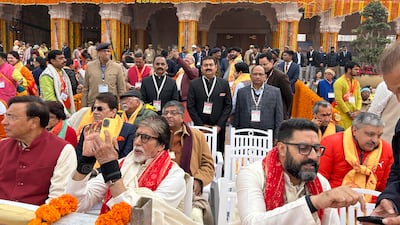 Bollywood actor Amitabh Bachchan, with his son, was among the chief guests at the opening of a temple. AP