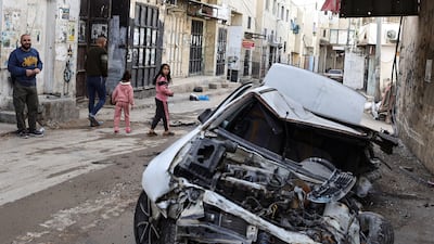 A damaged car in Jenin refugee camp following an overnight Israeli raid. AFP