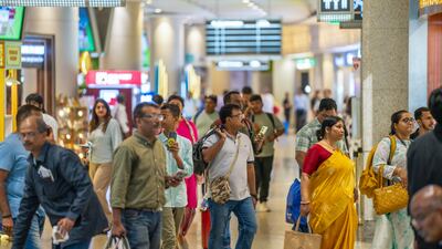 Travellers at Mumbai airport. India is now among more than 140 states that use e-passports. Bloomberg