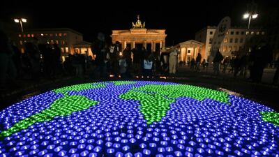 A globe illuminated with LED lights by activists of the World Wide Fund For Nature (WWF) in front of the Brandenburg Gate to mark Earth Hour, in Berlin. Markus Schreiber / AP
