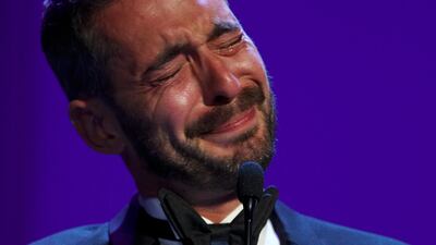 Director Xavier Legrand gets emotional after being awarded the Silver Lion for best director for Jusqu' a la garde or Custody during the award ceremony at the 74th Venice Film Festival. Domenico Stinellis / AP photo