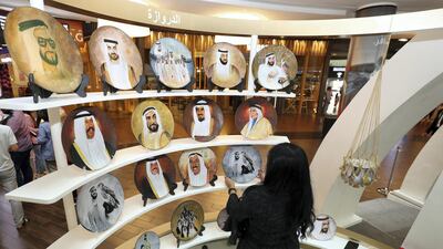 Hand painted plates on sale during a joint Emirati-Kuwaiti exhibition in Dubai. Chris Whiteoak / The National