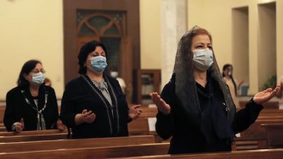 Iraqi Christians attend a Sunday service in one of the Chaldean churches that reopened after months of closure due to the coronavirus disease outbreak, in Baghdad, Iraq. REUTERS