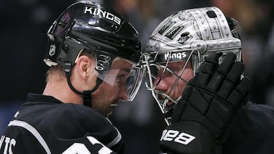 Los Angeles Kings centre Trevor Lewis, left, and goalie Jonathan Quick congratulate each other after Saturday’s win. Mark J Terrill / AP Photo