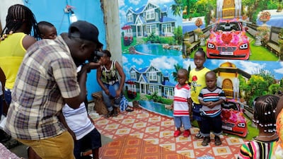 Children have their picture taken in a street on Christmas day in Monrovia, Liberia. REUTERS/Thierry Gouegnon