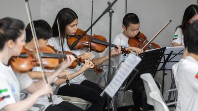 The orchestra plays.