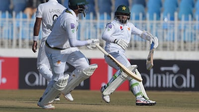 Abid Ali, right, and Pakistan captain Azhar Ali get into a mix-up during the fifth day of the Rawalpindi Test. AFP