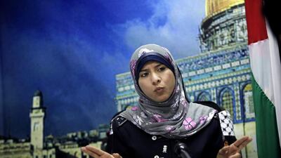 Isra Almodallal, 23, who speaks fluent English, has assumed a post normally held by tough-talking men who voice Hamas’s bitter opposition to Israel. Adel Hana/ AP