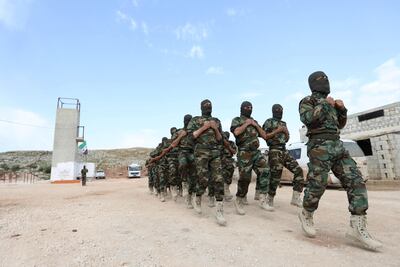 Rebels from the Jaysh Al Izza group, affiliated with the Turkish-backed Free Syrian Army, take part in a training session in Idlib province on April 9, 2018. Omar Haj Kadour / AFP