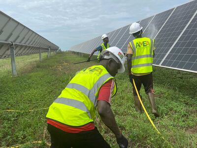 Amea Power employs local people to clean the panels and maintain the site. Andy Scott / The National