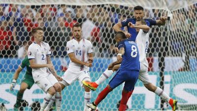 Dimitri Payet shoots to score France’s third goal. Darren Staples / Reuters