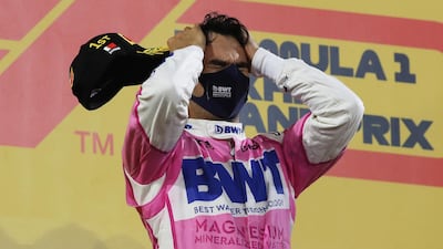 Sergio Perez of Racing Point celebrates on the podium after winning the Sakhir Grand Prix at the Bahrain International Circuit on Sunday. Getty