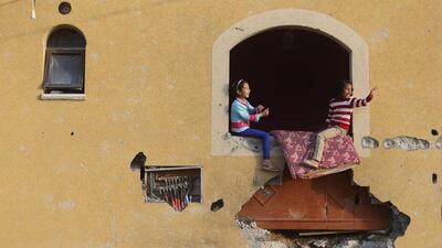 Palestinian girls play at their family's house in Khan Younis in the southern Gaza Strip. Ibraheem Abu Mustafa / Reuters