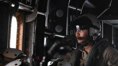 A US soldier on board a Black Hawk helicopter reconnaissance flight looks on during the International Maritime Exercise in the Gulf waters off Bahrain. AFP
