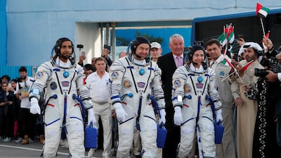 ISS crew members Jessica Meir of the US, Oleg Skripochka of Russia and Hazza Al Mansouri of the UAE walk to the launchpad at the Baikonur Cosmodrome, Kazakhstan. Shamil Zhumatov / Reuters