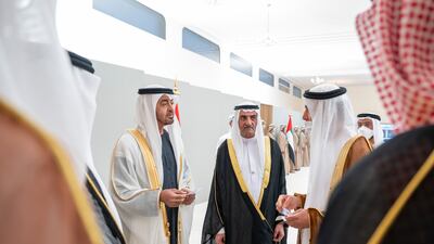 Sheikh Mohamed bin Zayed, Crown Prince of Abu Dhabi and Deputy Supreme Commander of the Armed Forces, left, and Sheikh Hamad bin Mohammed Al Sharqi, Ruler of Fujairah, centre, witness the launch of the UAE's new currency. Seen with Khaled Mohammed Balama, Governor of the Central Bank of the UAE. Mohamed Al Hammadi / Ministry of Presidential Affairs