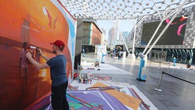 Artist Nikolaj Arndt, from Russia, gives the final touch at the Dubai 3D Art Festival at the Dubai City Walk in Dubai. Satish Kumar / The National