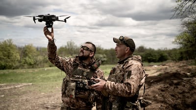 Ukrainian soldiers make final checks to fly drones in Donetsk. Getty Images