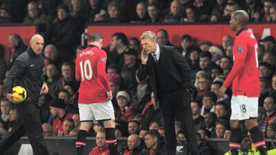 United manager David Moyes speaks to Wayne Rooney during the 3-1 Premier League victory against West Ham United at Old Trafford in December 2013. Getty