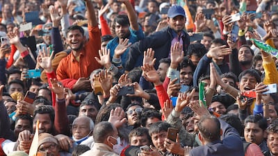 Supporters of India's ruling Bharatiya Janata Party cheer during an election campaign rally in Uttar Pradesh, on February 10, 2022. Reuters