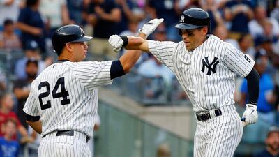 The New York Yankees' resurgence has led an extra element of drama to the AL East race in the closing weeks of the baseball season. Jim McIsaac / Getty Images / AFP / September 10, 2016