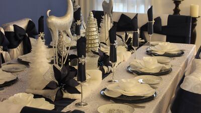 A blue-and-white 'dashing through the midnight snow'-themed tablescape in Janet Manning Waite's home. Photo: Janet Manning Waite