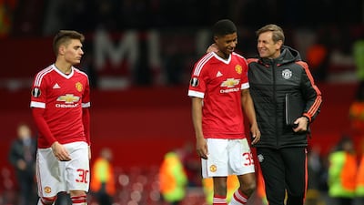 Marcus Rashford is congratulated by United goalkeeping coach Frans Hoek after the match. Getty