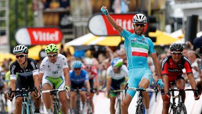 Astana Procycling team rider Vincenzo Nibali, centre, of Italy celebrates after winning the second stage of the 101st edition of the Tour de France between York and Sheffield. Bas Czerwinski / EPA