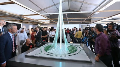 Visitors take a look at a scale model of the observation tower planned for Dubai. Pawan Singh / The National