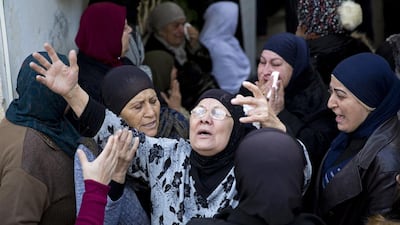 Friends and relatives of 18-year-old Layan Nasser mourn during her funeral in Tira on January 3, 2017. Ariel Schalit/AP Photo