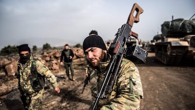 Turkish troops advance near the Syria border at Hassa on January 22, 2018, as part of the operation dubbed "Olive Branch". Bulent Kilic / AFP