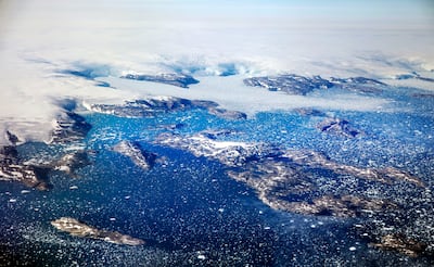 Icebergs float in a fjord after calving from glaciers on the Greenland ice sheet. AP