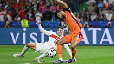 Mert Muldur and Cody Gakpo battle for the ball which ended in the Turkish player scoring an own-goal. Getty Images