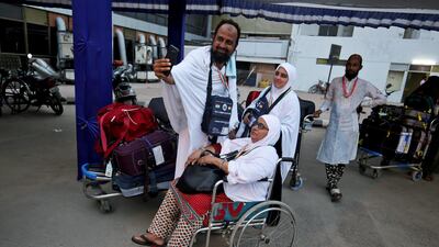 Hajj pilgrims take a selfie before leaving for the annual hajj pilgrimage to the holy city of Makkah, at the airport in Ahmedabad, India, August 1, 2018. Reuters