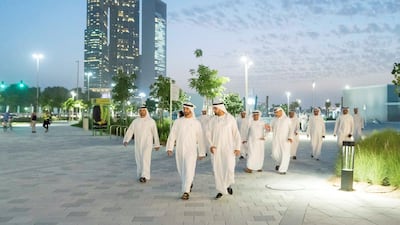Sheikh Mohamed bin Zayed is briefed on the development, which opened in March, as he tours A'l Bahar with Mohammed Al Mubarak. Rashed Al Mansoori / Ministry of Presidential Affairs