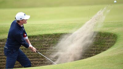 US amateur Jordan Niebrugge plays out of the sand at the 16th hole on Thursday during the opening round of the Open Championship. He finished tied for eighth at 5-under. Stuart Franklin / Getty Images