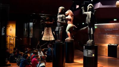 Big royal statues of the Kingdom of Dahomey dating back to 1890-1892 are pictured on June 18, 2018 at the Quai Branly Museum-Jacques Chirac in Paris. Benin is demanding restitution of its national treasures that had been taken from the former French colony Dahomey (current Benin) to France and currently are on display at Quai Branly, a museum featuring the indigenous art and cultures of Africa. / AFP / GERARD JULIEN