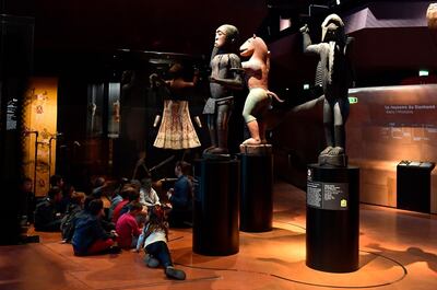 Big royal statues of the Kingdom of Dahomey dating back to 1890-1892 are pictured on June 18, 2018 at the Quai Branly Museum-Jacques Chirac in Paris. Benin is demanding restitution of its national treasures that had been taken from the former French colony Dahomey (current Benin) to France and currently are on display at Quai Branly, a museum featuring the indigenous art and cultures of Africa. / AFP / GERARD JULIEN