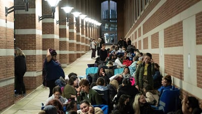 People waiting after midnight. AFP