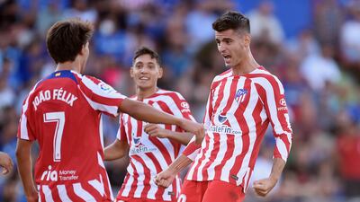 Alvaro Morata celebrates with Atletico teammates after scoring their first goal against Getafe. Getty