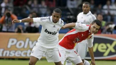 Real Madrid's Robinho and Santa Fe's Francisco Najera fight for the ball during their friendly in Bogota earlier this month.