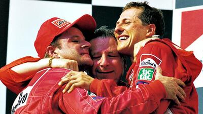 Michael Schumacher enjoyed a strong union at Ferrari with team principal Jean Todt, centre, and teammate Rubens Barrichello, left. Allsport