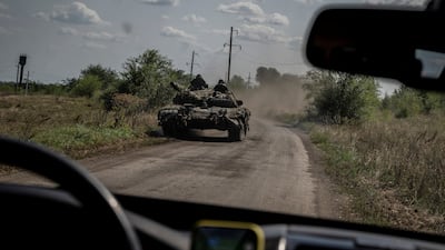 Ukrainian servicemen on a tank near the village of Robotyne, Zaporizhzhia region. Reuters