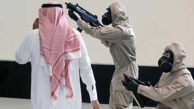 Above, armed personnel suits on display at Idex 2017. Satish Kumar / The National