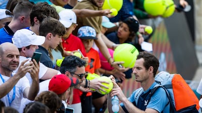 Andy Murray signs autographs after his semi-final win against Australia's Nick Kyrgios in Stuttgart, Germany, Saturday, June 11, 2022. AP