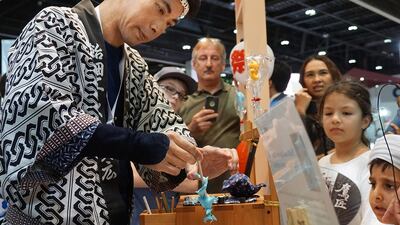 Japanese sweet maker Takahiro Mizuki creates traditional candy animal sculptures, in 2015. Delores Johnson / The National